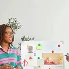 Colleagues discussing ideas in front of a whiteboard